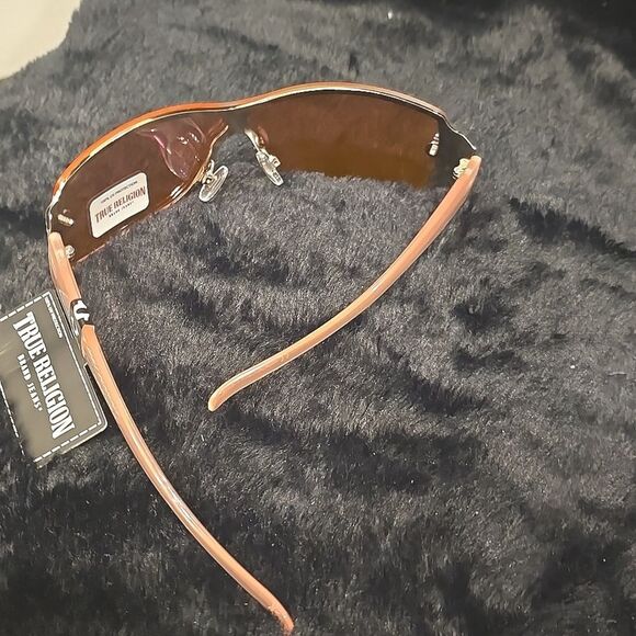True Religion Rimless Wraparound Sunglasses- Pink Acetate